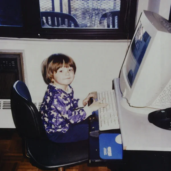 Anthony Krivonos as a child, at a desktop computer in 2001